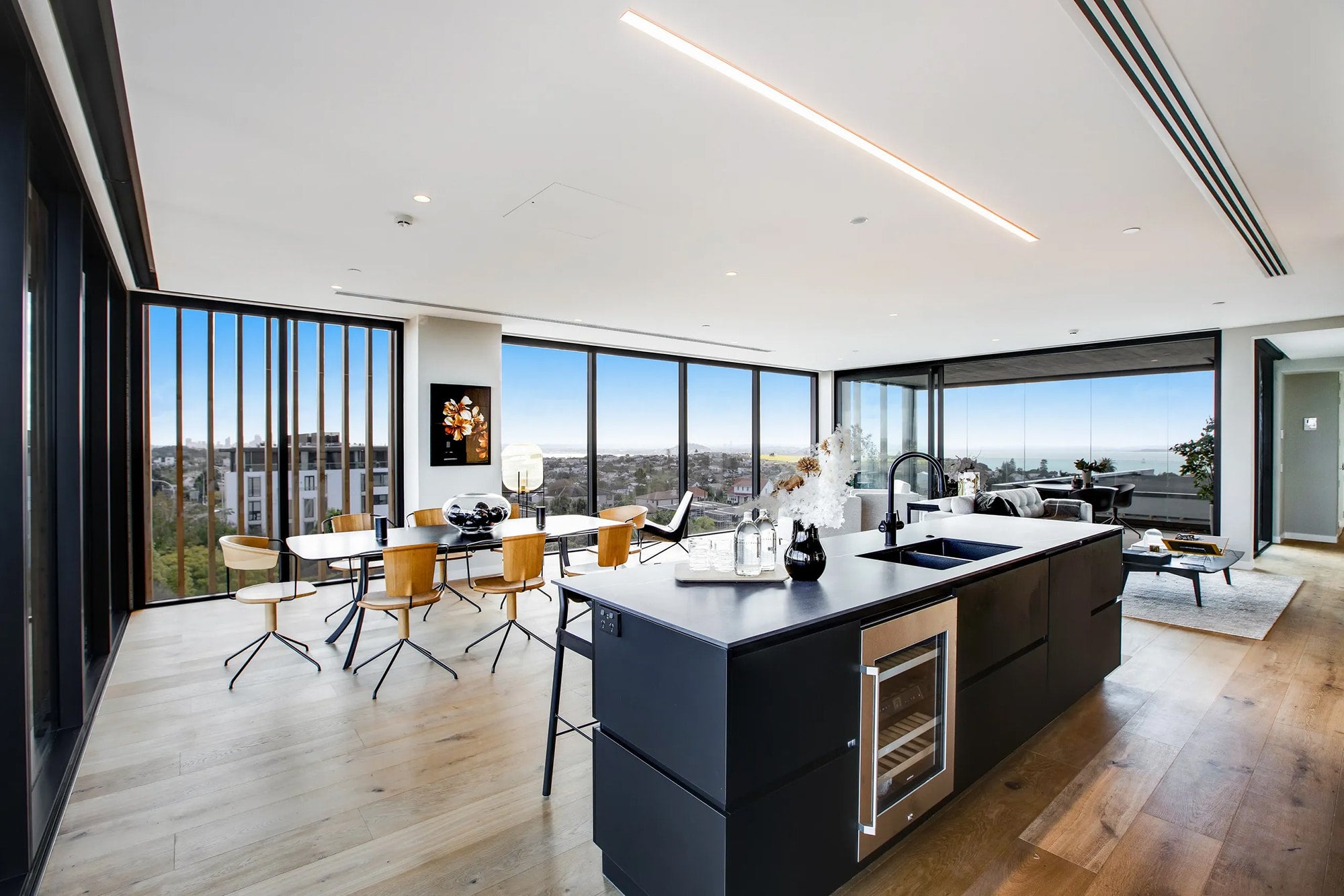 Modern kitchen with large windows and a cityscape view
