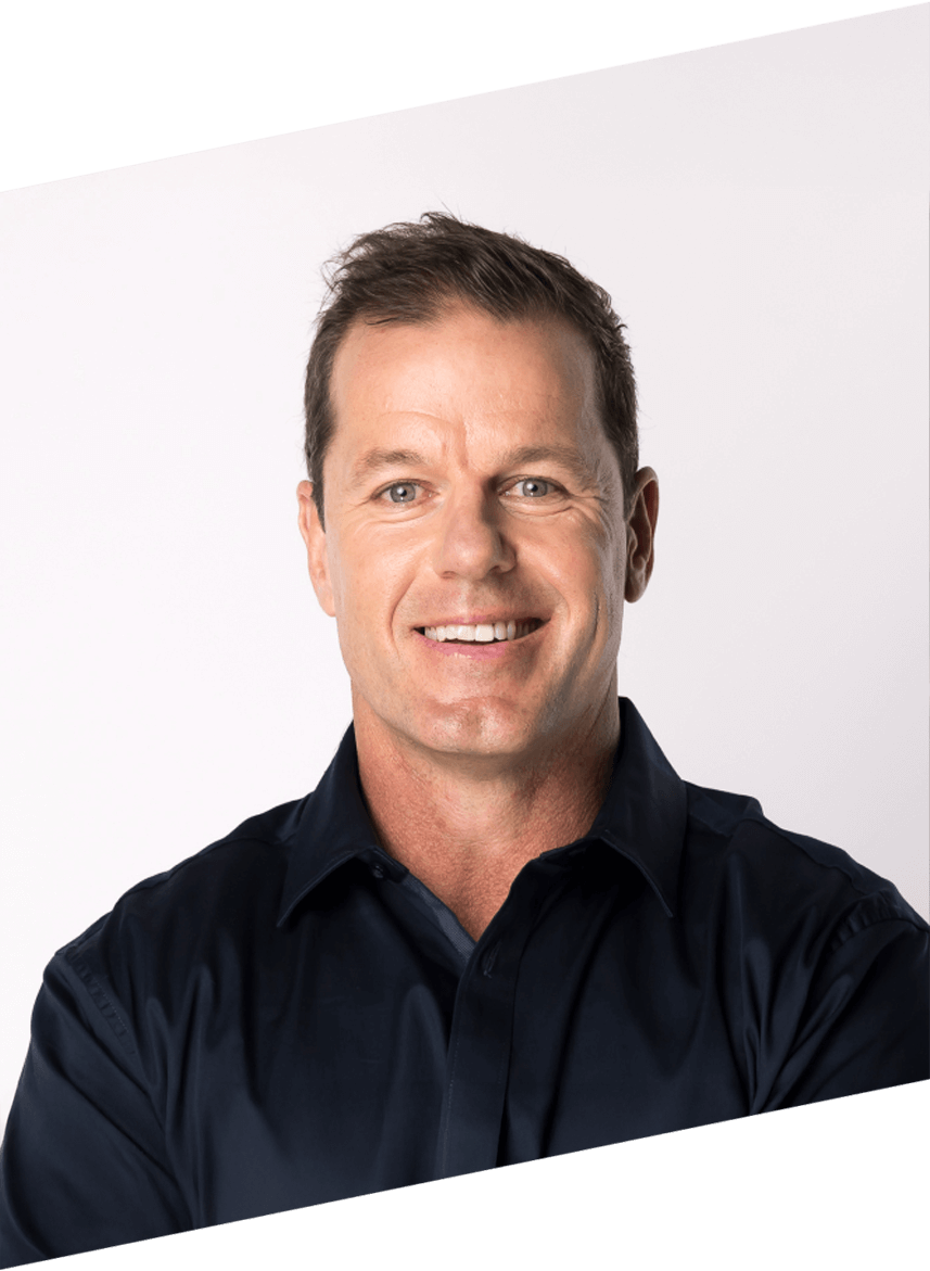 Man wearing a dark blue shirt against a white background